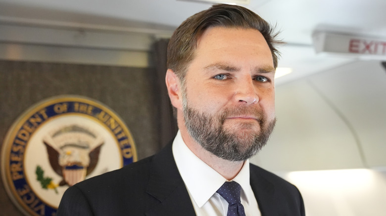 JD Vance posing for photos aboard Air Force One