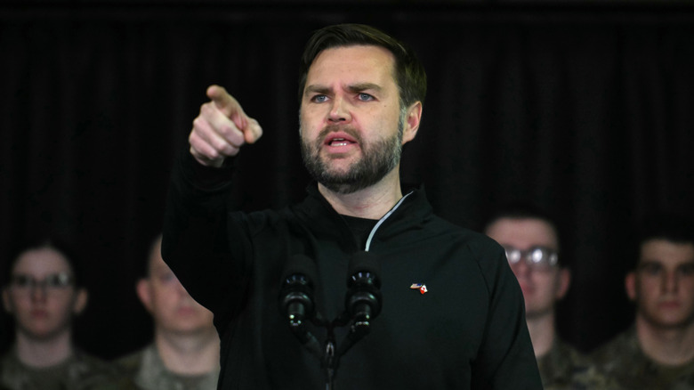JD Vance points while making a speech