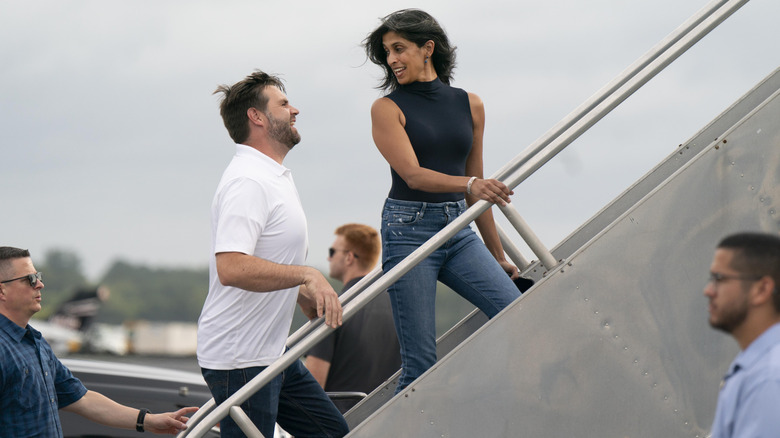 JD Vance and Usha Vance walk up stairs