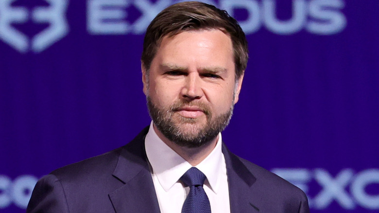 JD Vance squinting against a bright light