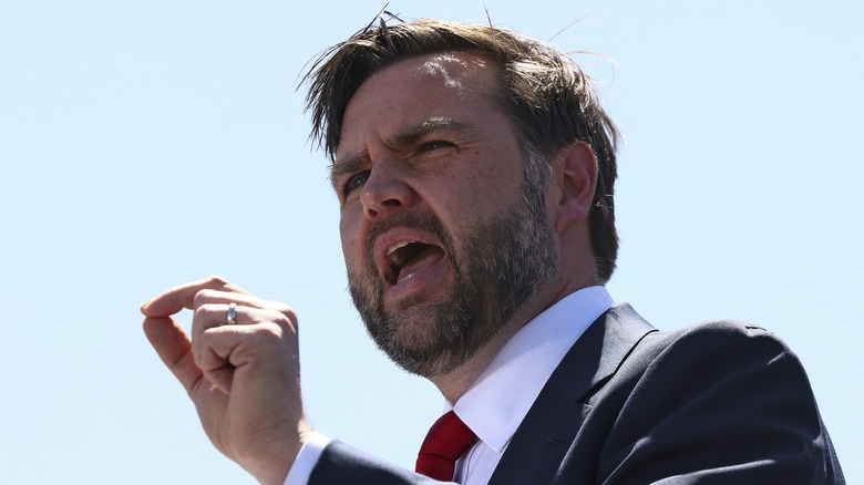 JD Vance talking with messy looking hair