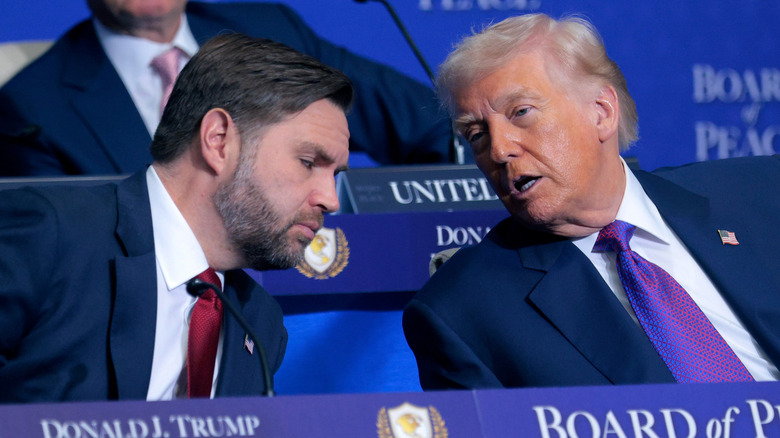 JD Vance listening to Donald Trump talking