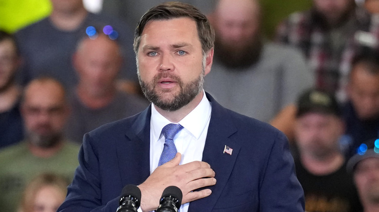 JD Vance with a pleading expression