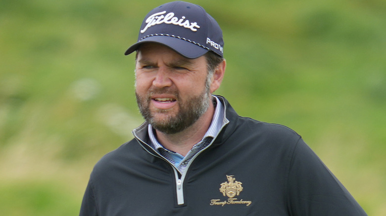 JD Vance looking confused while golfing