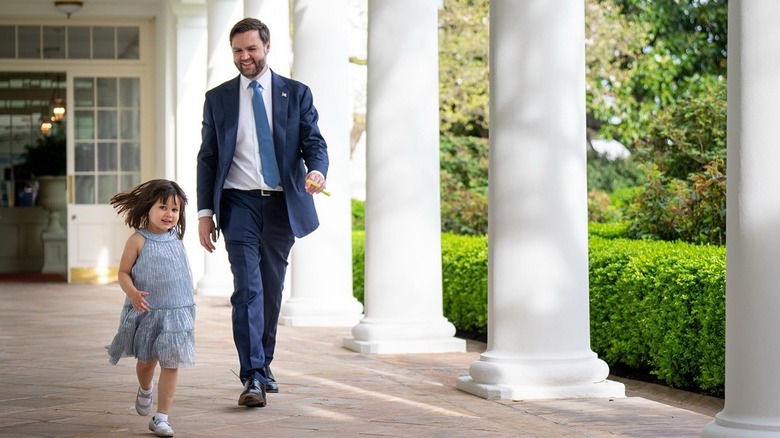 JD Vance smiling and running with daughter Mirabel outside the White House
