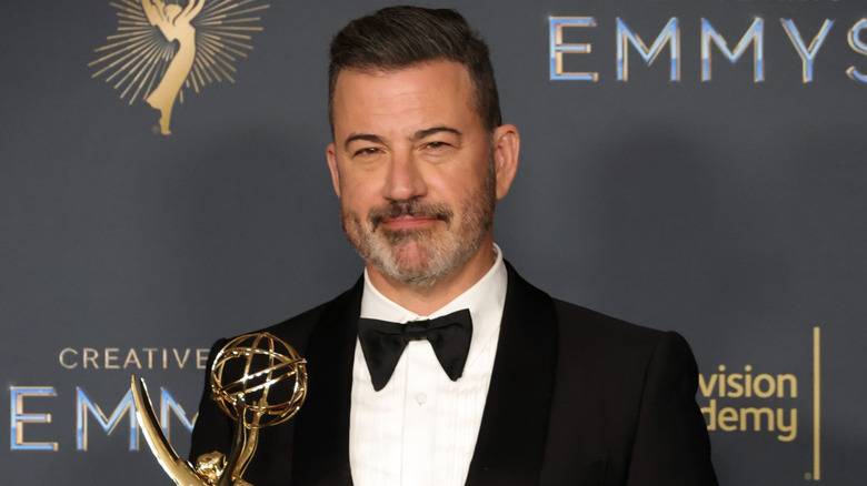 Jimmy Kimmel posing with Emmy award