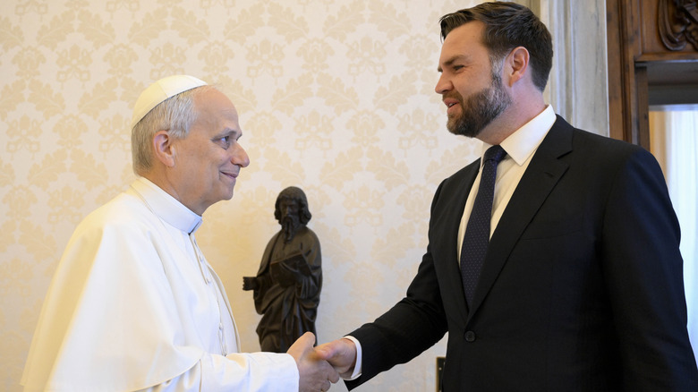 Pope Leo XIV shaking JD Vance's hand