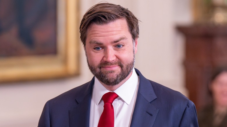 Vice President JD Vance smiles and attends an event in the East room at the White House in May 2025