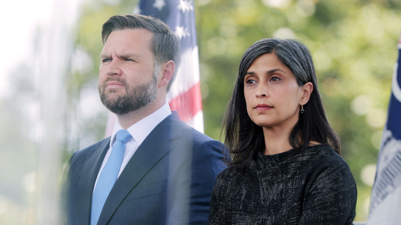 Vice President JD Vance and his wife Usha Vance sitting quietly at a memorial