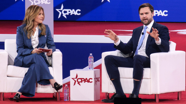 JD Vance attends a conference and speaks onstage
