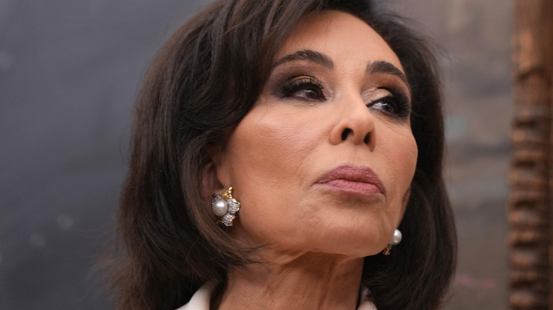 Jeanine Pirro look to the side at her swearing in