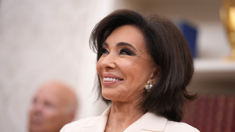 Jeanine Pirro grinning at her swearing in