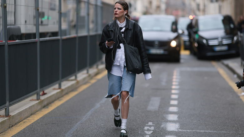 cutt off jorts, button-down, and leather jacket