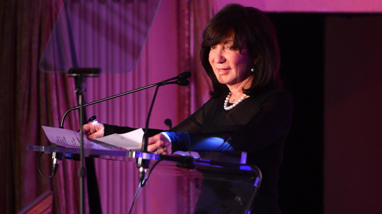 Jackie Bezos speaking at a podium