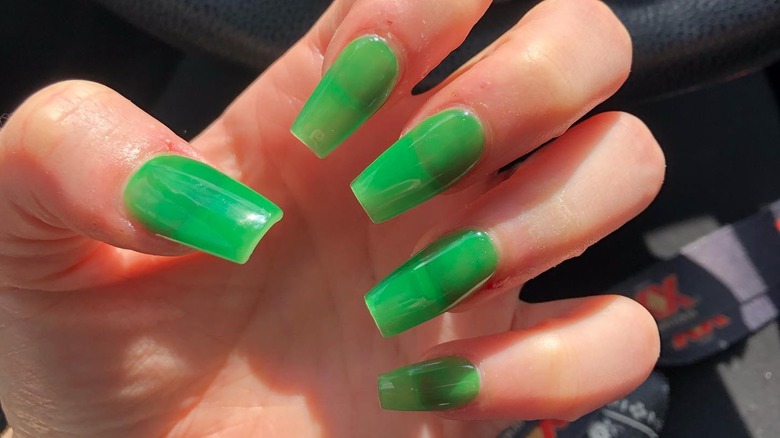 hand with green manicure