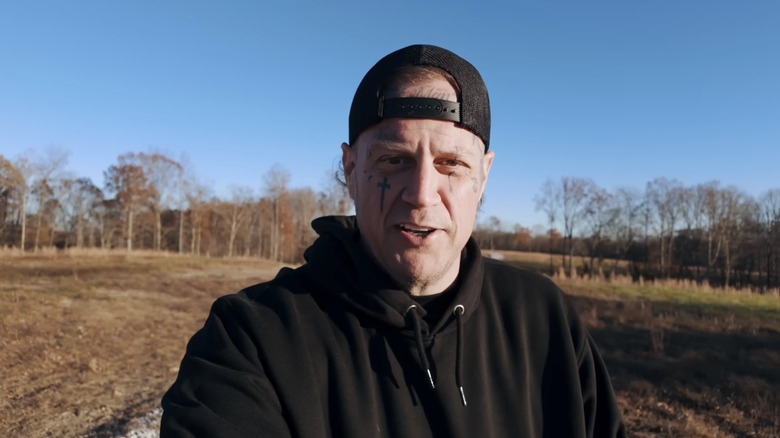 Jelly Roll looks at the camera without a beard