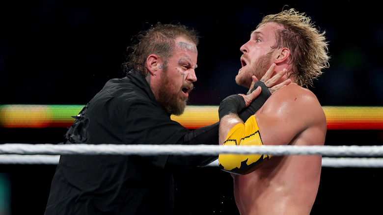 Jelly Roll hitting Logan Paul during wrestling match at at WWE SummerSlam