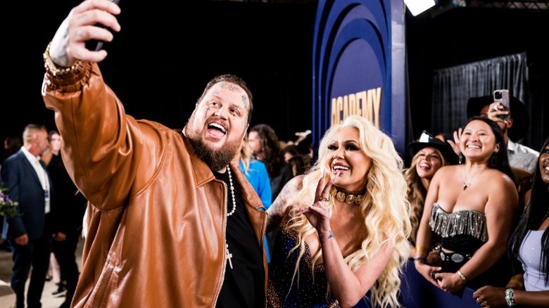 Jelly Roll and Bunnie Xo take photos with fans at the Academy of Country Music Awards in Frisco, TX (2024)