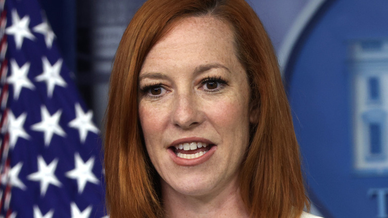 Jen Psaki speaking at podium