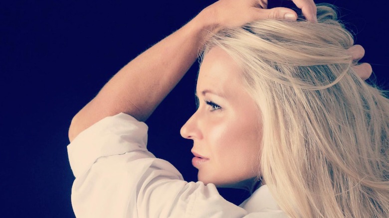 Jen posing against dark background