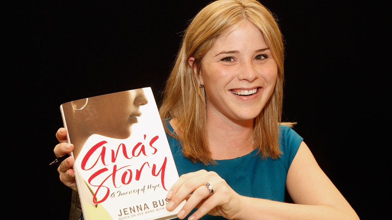 Jenna Bush Hager showing off her engagement ring as she holds up her book "Ana's Story: A Journey of Hope"