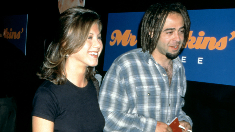 Adam Duritz and Jennifer Aniston walking
