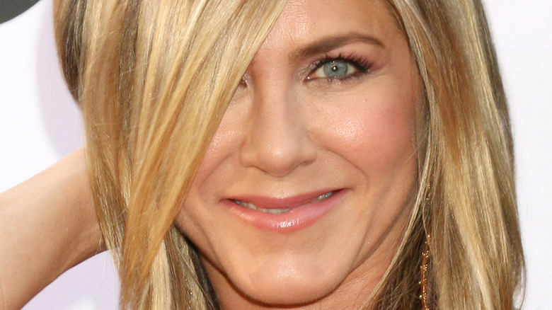 Jennifer Aniston plays with her hair