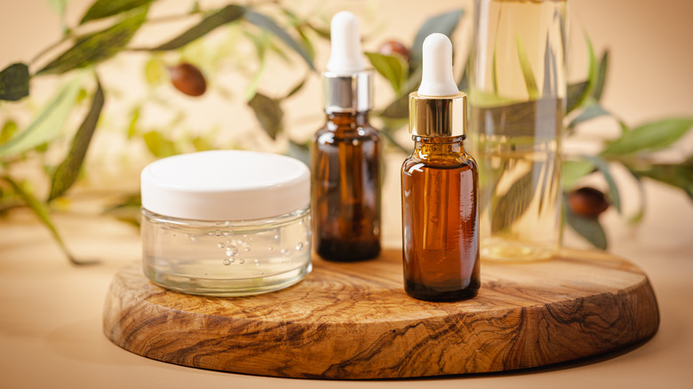 skincare products on wooden tray