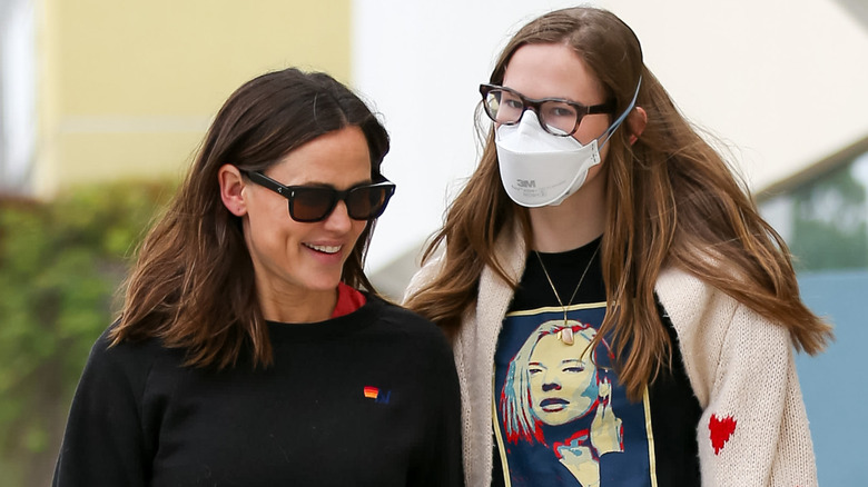 Jennifer Garner in sunglasses with Violet Affleck wearing mask