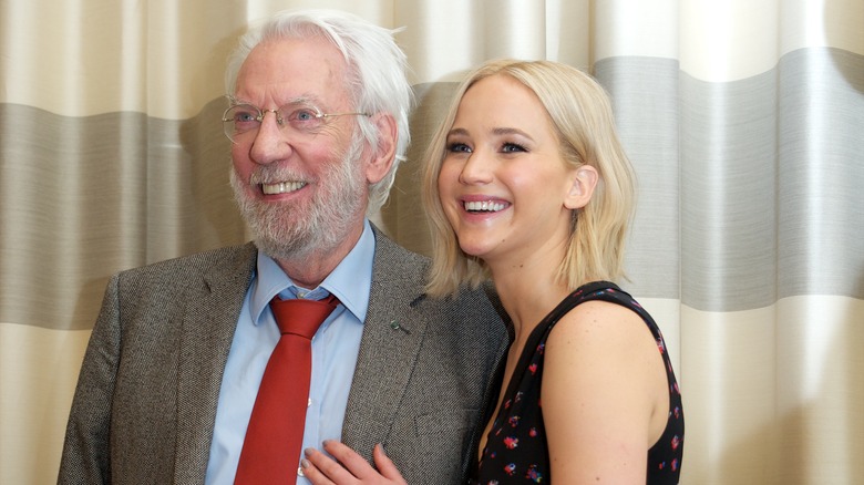 Donald Sutherland and Jennifer Lawrence smiling at an event