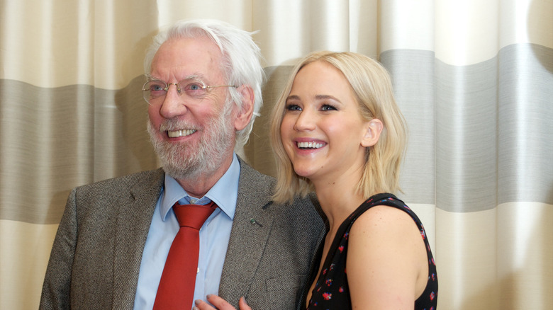 Donald Sutherland and Jennifer Lawrence smiling at an event