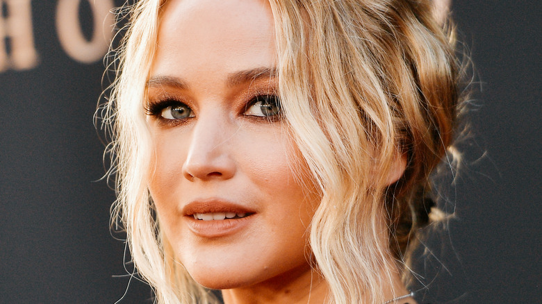 Jennifer Lawrence smiles at an event