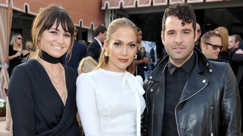 Stylists Mariel Haenn and Rob Zangardi posing with Jennifer Lopez