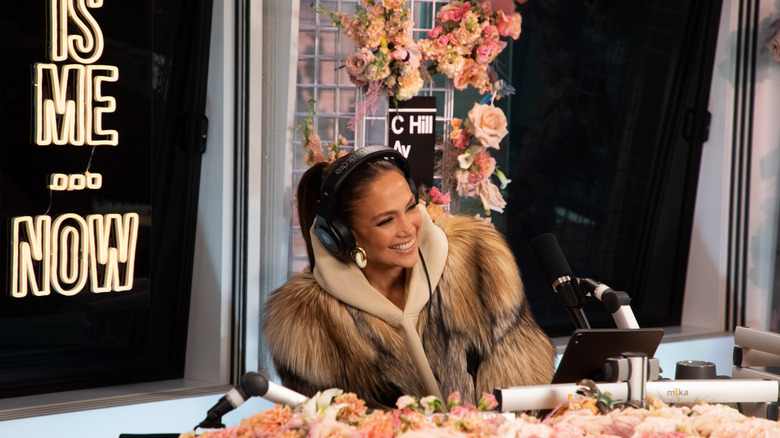 Jennifer Lopez laughing into mic during an interviewe
