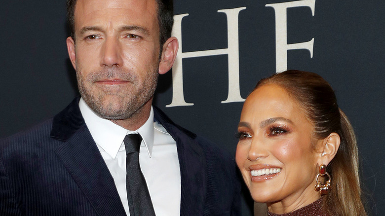 Jennifer Lopez and Ben Affleck smile on the red carpet