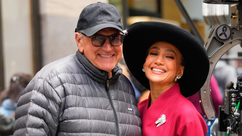 Robert Zemeckis and Jennifer Lopez smiling together with a movie camera next to them