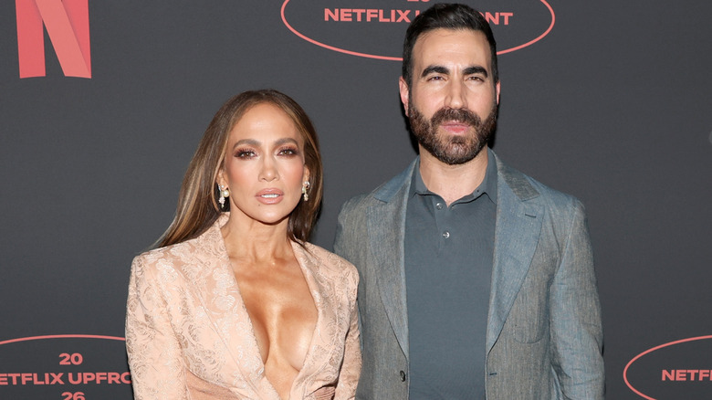 Jennifer Lopez and Brett Goldstein posing on the red carpet