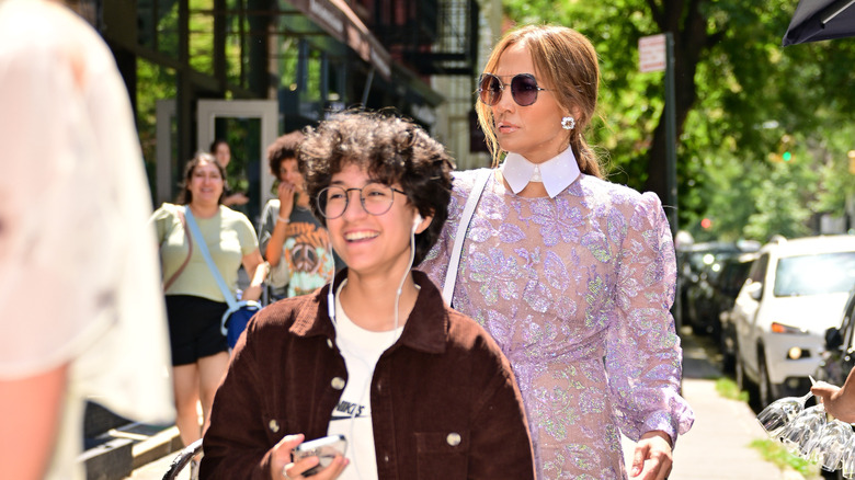 Emme Muñiz and J.Lo walking in street together