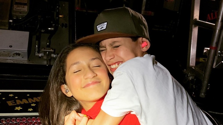 Emme Muñiz and Max Muñiz hugging