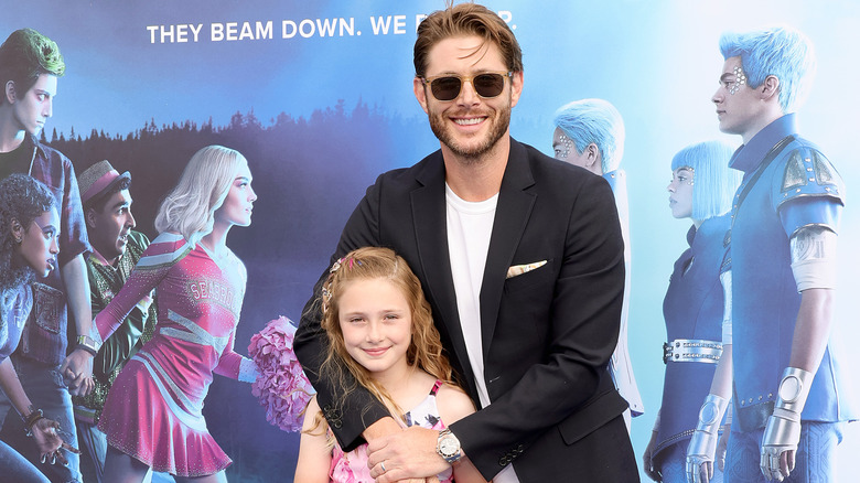 Jensen hugs his daughter on the red carpet