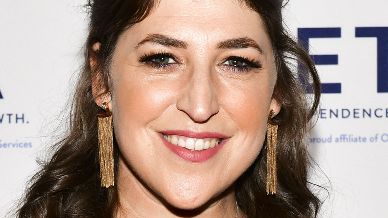 Mayim Bialik smiles on the red carpet