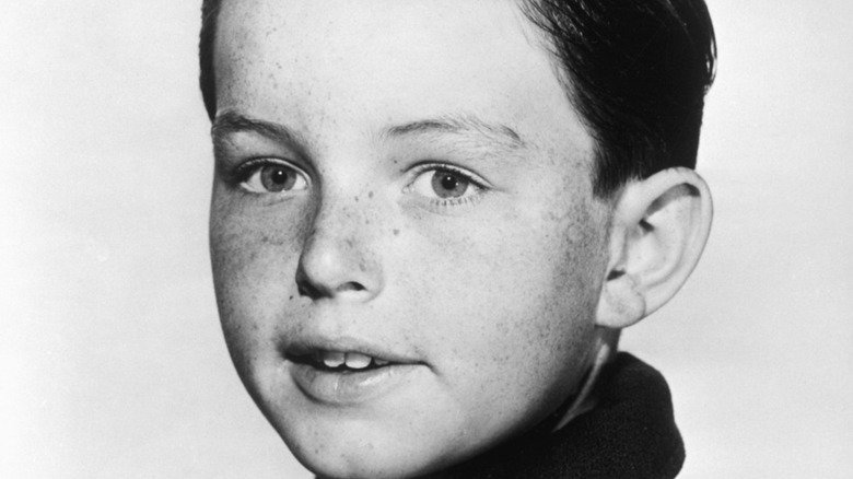 Jerry Mathers smiling in a 1961 portrait.