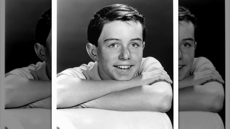 Jerry Mather smiling in a 1965 portrait.