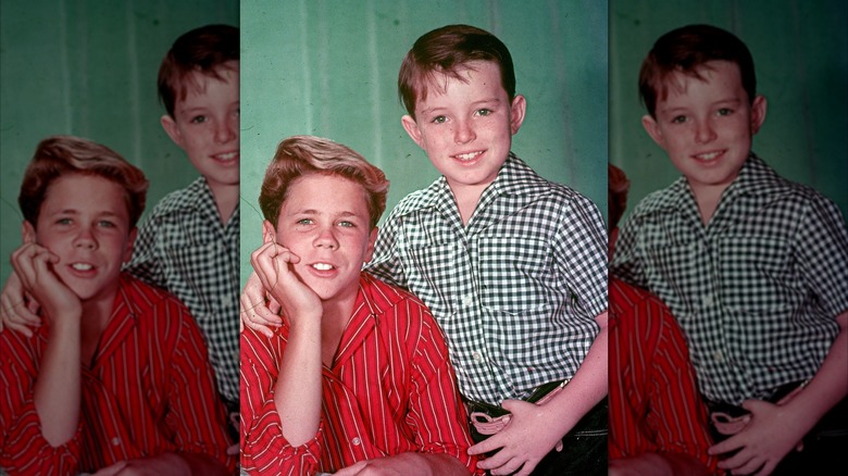 Tony Dow and Jerry Mathers smiling in a 1957 photograph.