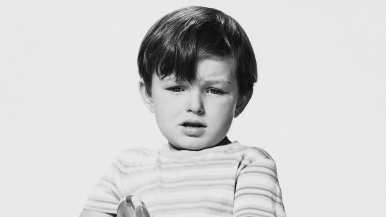 Jerry Mathers smiling in a portrait photo