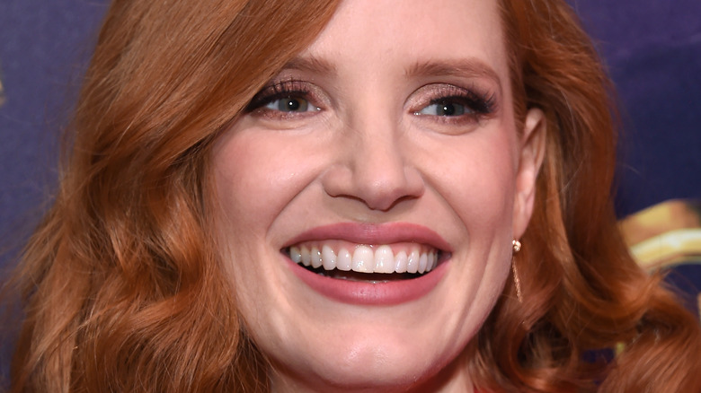 Jessica Chastain smiling while having her picture taken