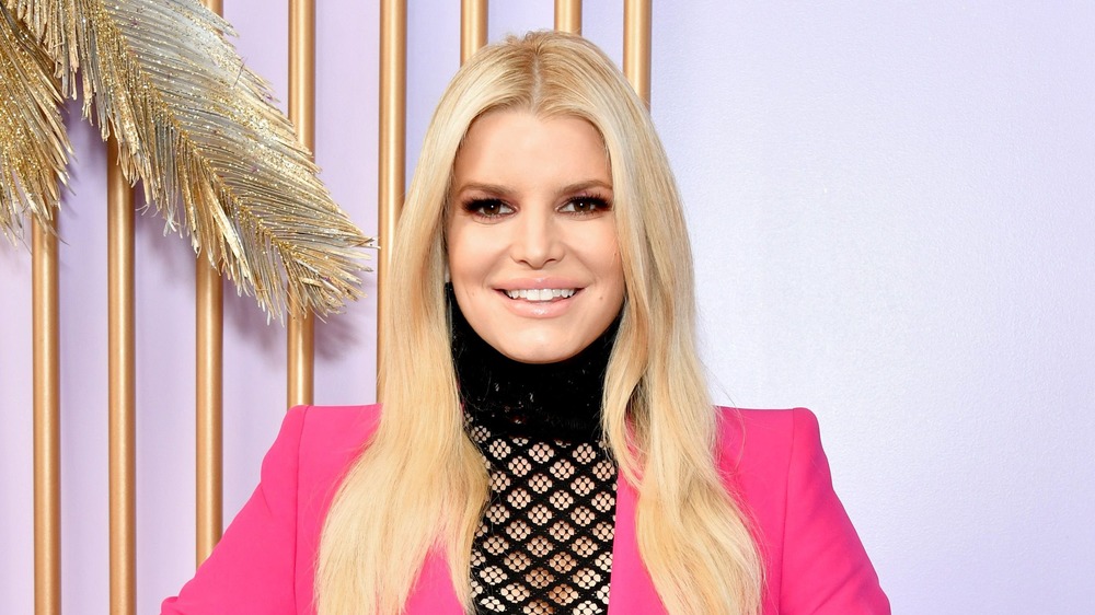 Jessica Simpson smiles in pink