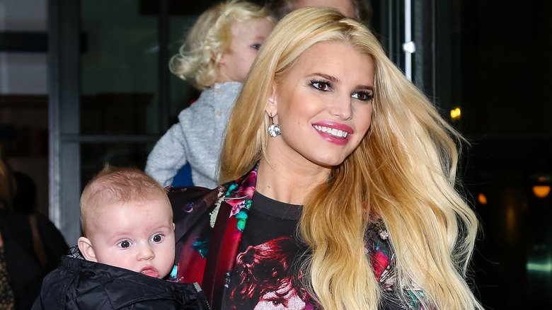 Jessica Simpson holding baby