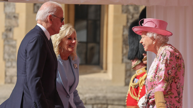 Joe Biden and Jill Biden talking with Queen Elizabeth