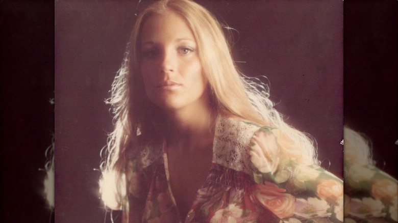 Jill Biden could be seen posing for a photo while sporting long hair and a floral print dress in this image shared by Biden in 2020 (2020)